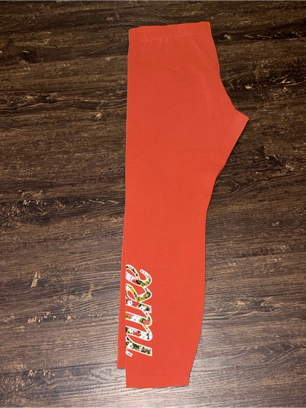 Nike Orange Leggings with Floral Script Accent